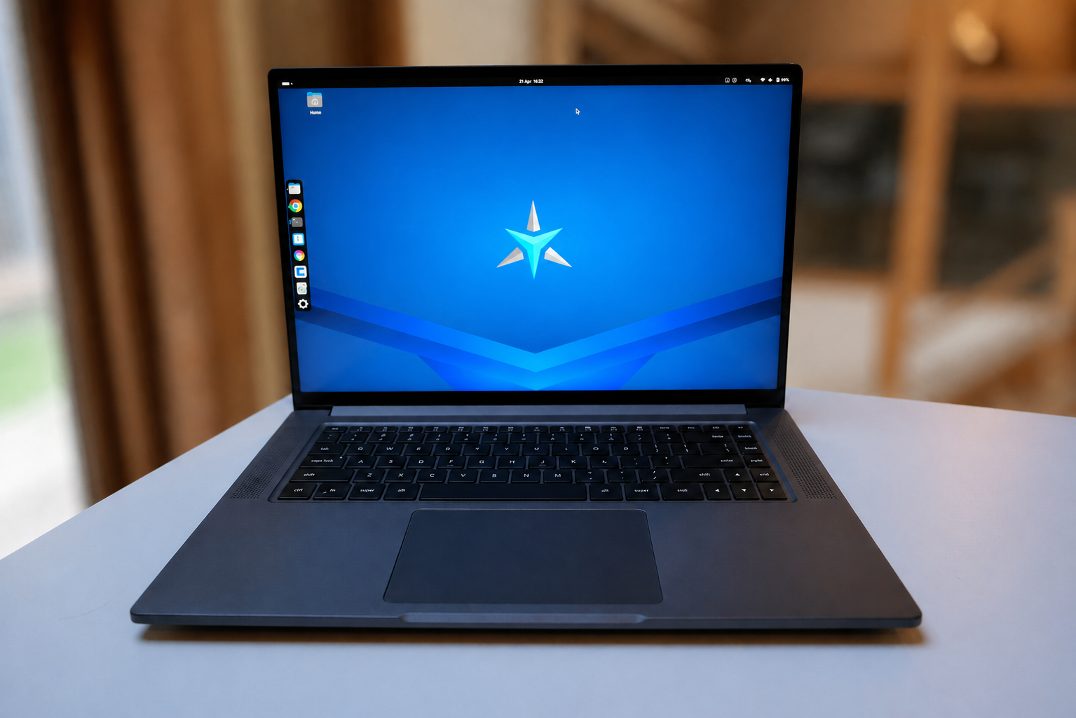 StarBook Horizon laptop on a softly blurred interior backdrop